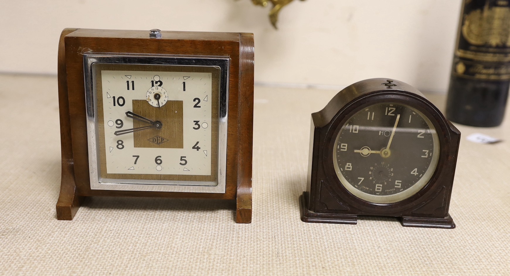 Two Bakelite Art Deco clocks and a DEP clock, largest 24cms high